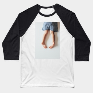 Legs of Small Girl Lying on White Tabletop Baseball T-Shirt